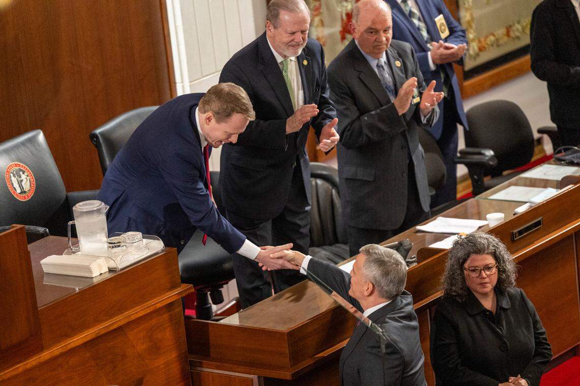 Gov. Josh Stein is greeted by Lt. Gov. Rachel Hunt, House Speaker Destin Hall, and Senate leader Phil Berger before delivering his State of the State address to a joint session of the General Assembly on Wednesday, March 12, 2025, in the House chamber of the Legislative Building.