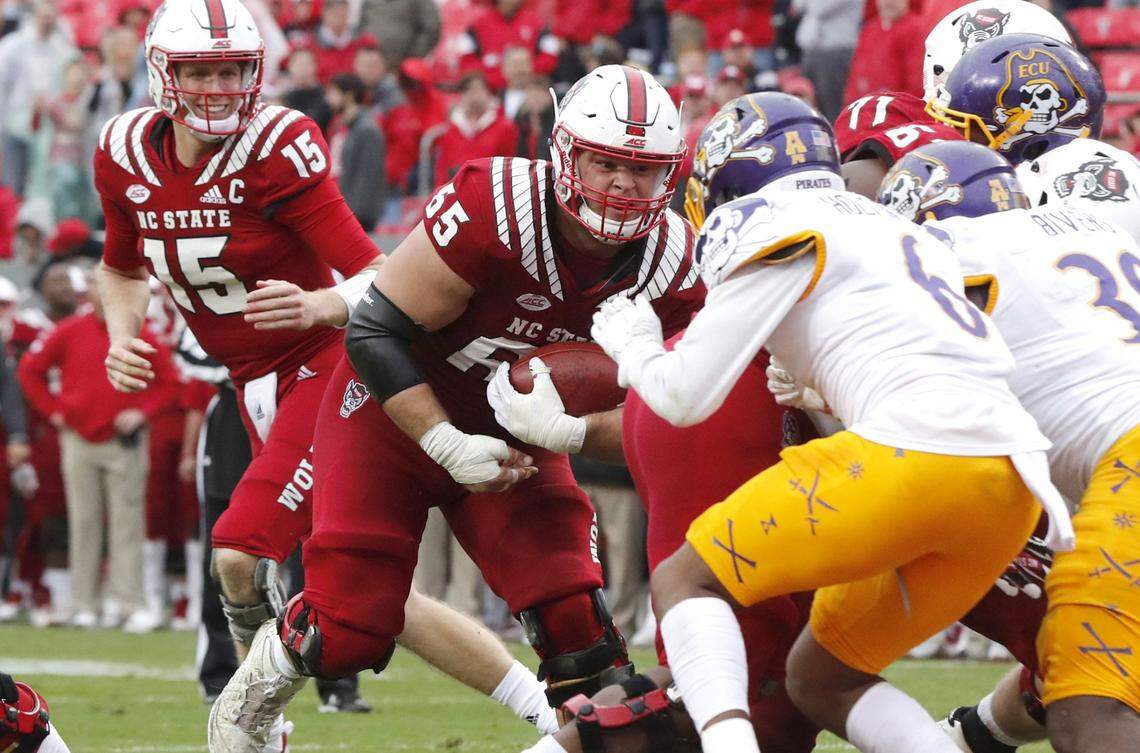 N.C. State center Garrett Bradbury (65) scores on a one-yard touchdown run during the Wolfpack’s 58-3 victory over East Carolina at Carter-Finley Stadium in 2018.
