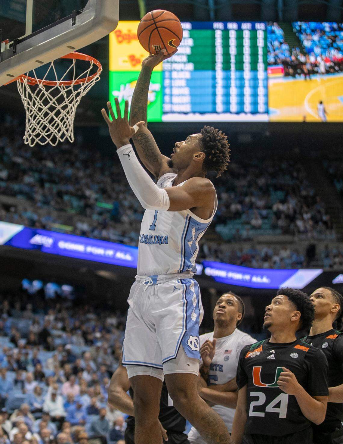 North Carolina’s Leaky Black (1) puts up a shot against Miami’s Nijel Pack (24) in the first half on Monday, February 13, 2023 at the Smith Center in Chapel Hill, N.C.