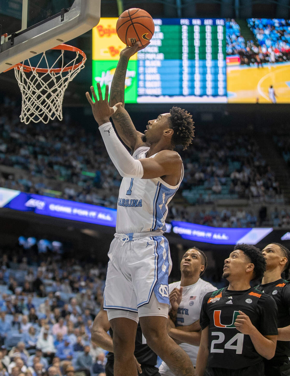 North Carolina’s Leaky Black (1) puts up a shot against Miami’s Nijel Pack (24) in the first half on Monday, February 13, 2023 at the Smith Center in Chapel Hill, N.C.