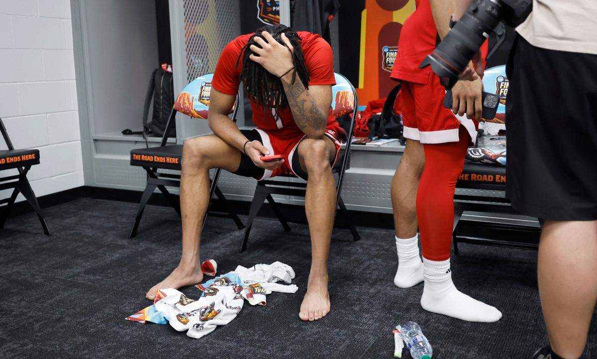 N.C. State’s Jayden Taylor sits in the locker room after Purdue’s 63-50 victory over N.C. State in the NCAA Tournament national semifinals at State Farm Stadium in Glendale, Ariz., Saturday, April 6, 2024.