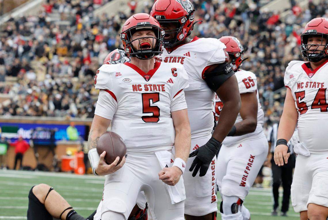 N.C. State quarterback Brennan Armstrong (5) celebrates after scoring on a one-yard touchdown run during the first half of N.C. State’s game against Wake Forest at Allegacy Stadium in Winston-Salem, N.C., Saturday, Nov. 11, 2023.