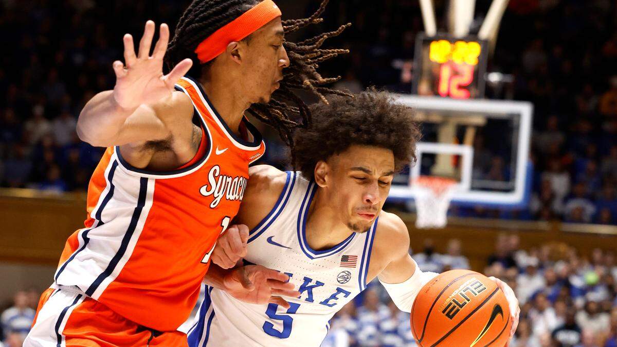 Duke’s Tyrese Proctor (5) is defended by Syracuse’s Maliq Brown (1) during the second half of Duke’s 86-66 victory over Syracuse at Cameron Indoor Stadium in Durham, N.C., Tuesday, Jan. 2, 2024.
