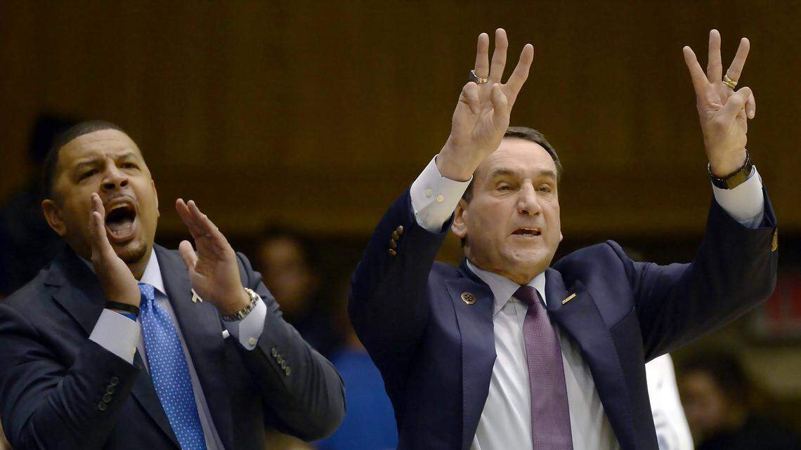 Duke head coach Mike Krzyzewski (right) and associate head coach Jeff Capel yell signals to the team as Duke beat Notre Dame 88-66 at Cameron Indoor Stadium In Durham, N.C., Monday, Jan. 29, 2018.