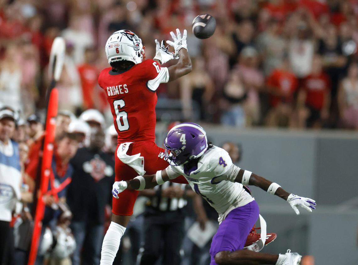 N.C. State wide receiver Wesley Grimes (6) pulls in a reception as Western Carolina cornerback CJ Williams (4) defends during the first half of N.C. State’s game against Western Carolina at Carter-Finley Stadium in Raleigh, N.C., Thursday, August 29, 2024.