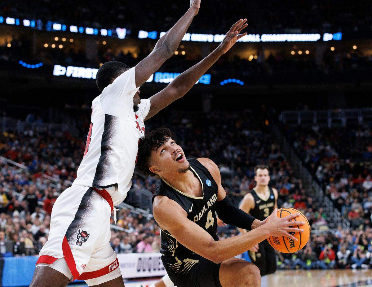N.C. State’s Mohamed Diarra pressures Oakland’s Trey Townsend during the first half of the Wolfpack’s 79-73 overtime win in the second round of the NCAA Tournament on Saturday, March 23, 2024, at PPG Paints Arena in Pittsburgh, Pa.