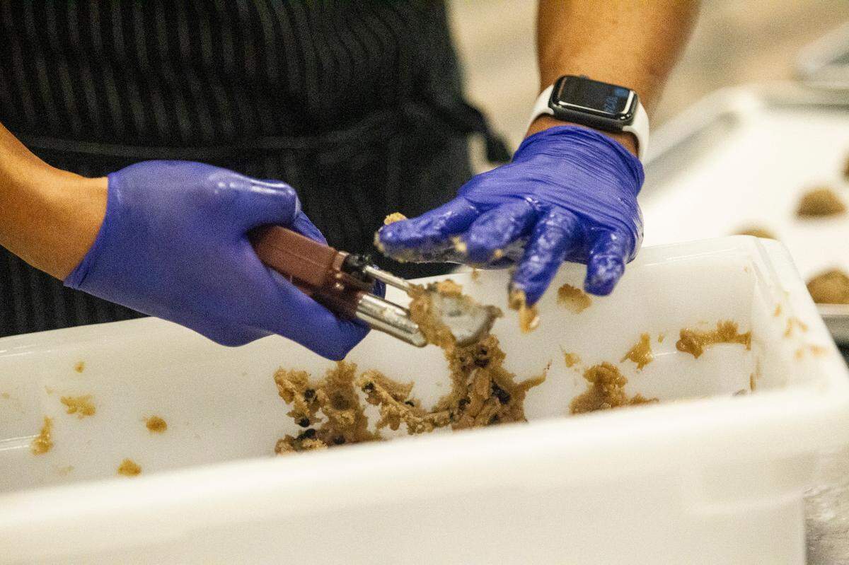 Matt Navarro prepares cookie dough at Without A Trace Foods in Raleigh Tuesday, Dec. 15, 2020. The startup makes allergy-free snacks.