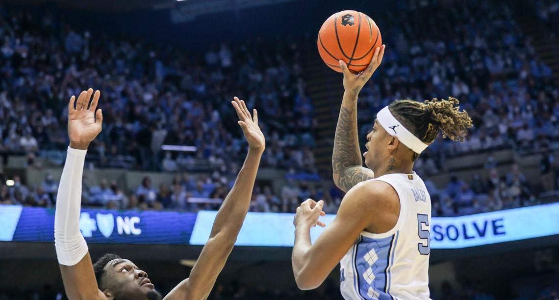 North Carolina’s Armando Bacot (5) shoots over Dukeís Mark Williams (15) during the second half of UNCís game against Duke Saturday, Feb. 5, 2022 at the Dean Smith Center. Duke won 87-67.