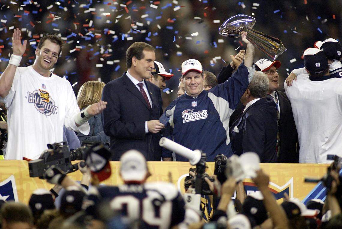 New England Patriots head coach Bill Belichick celebrates with the Vince Lombardi Trophy after defeating the Carolina Panthers during Super Bowl XXXVIII at Reliant Stadium in 2004.