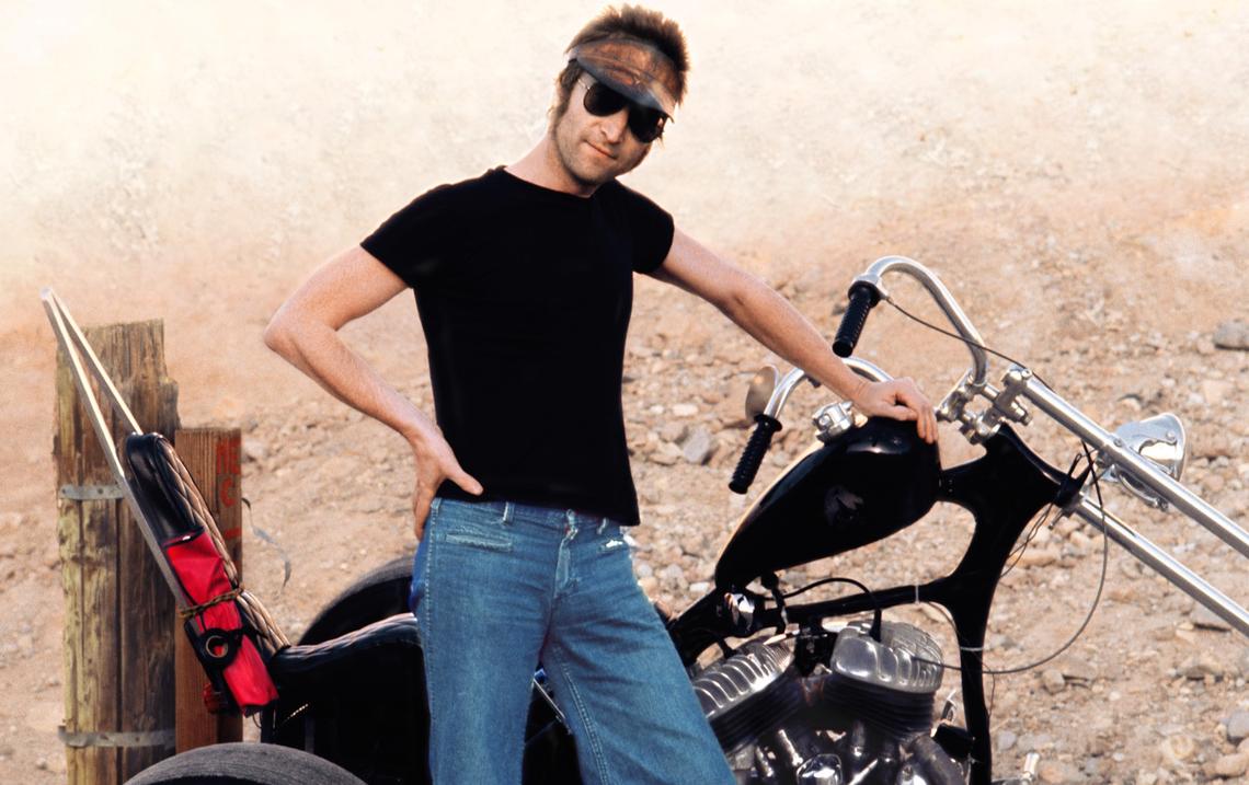 John Lennon poses with a trike discovered on a 1973 visit to the Calico Ghost Town in California. Only after taking the photo did Lennon’s girlfriend May Pang realize he was wearing her jeans, she said.