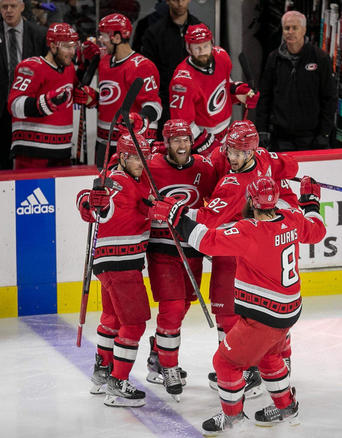The Carolina Hurricanes Jesperi Kotkaniemi (82) celebrates with teammates after scoring on New Jersey Devils goalie Akira Schmid (40) in the second period during Game 5 of their second round Stanley Cup playoff series on Thursday, May 11, 2023 at PNC Arena in Raleigh, N.C.