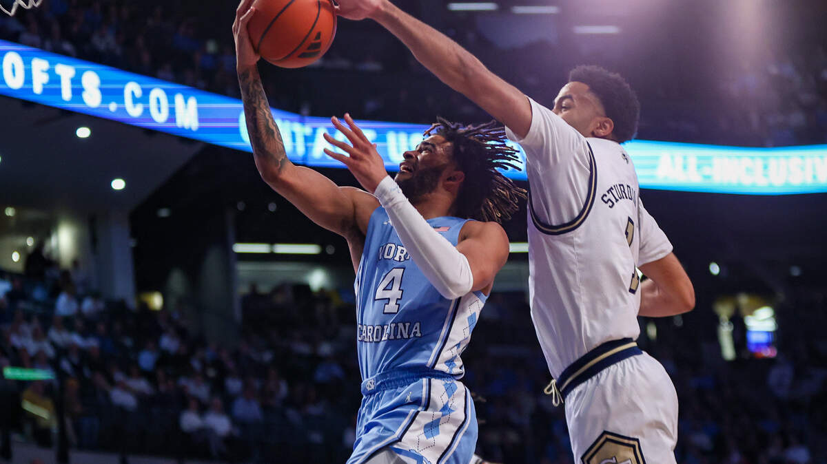 Jan 30, 2024; Atlanta, Georgia, USA; Georgia Tech Yellow Jackets guard Kyle Sturdivant (1) blocks the shot of North Carolina Tar Heels guard RJ Davis (4) in the first half at McCamish Pavilion. Mandatory Credit: Brett Davis-USA TODAY Sports