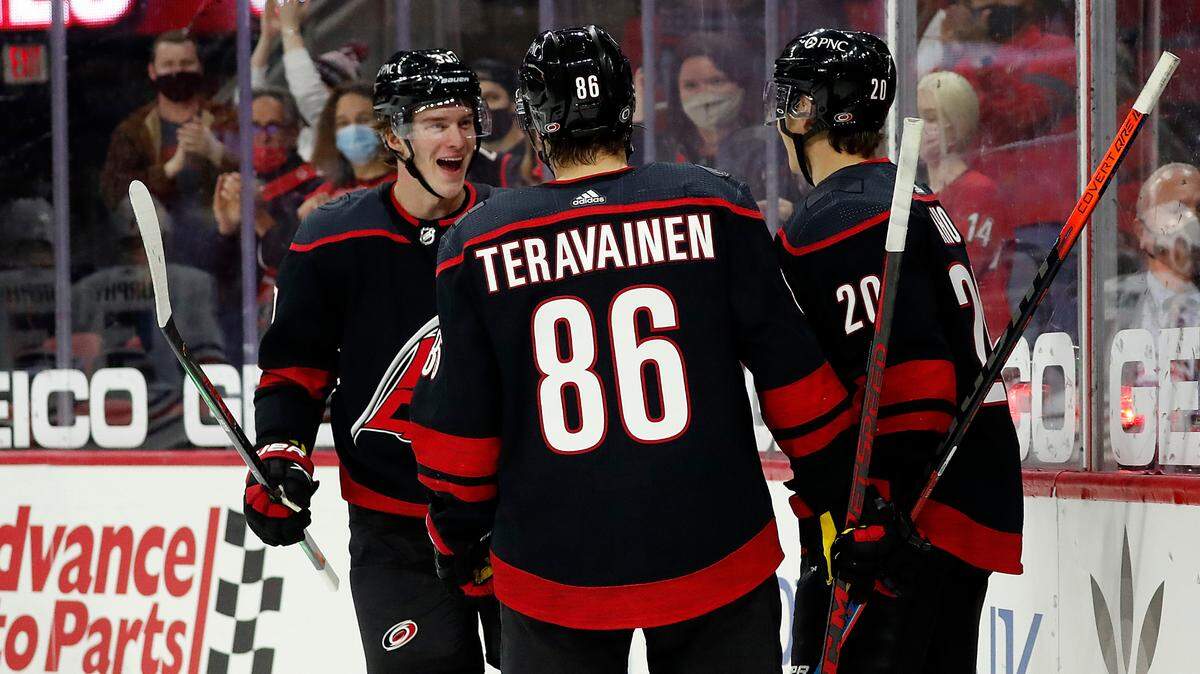 Carolina Hurricanes’ Andrei Svechnikov (37) Teuvo Teravainen (86) and Sebastian Aho (20) all were hopeful of competing in the 2022 Winter Olympics for their respective countries.. (AP Photo/Karl B DeBlaker)