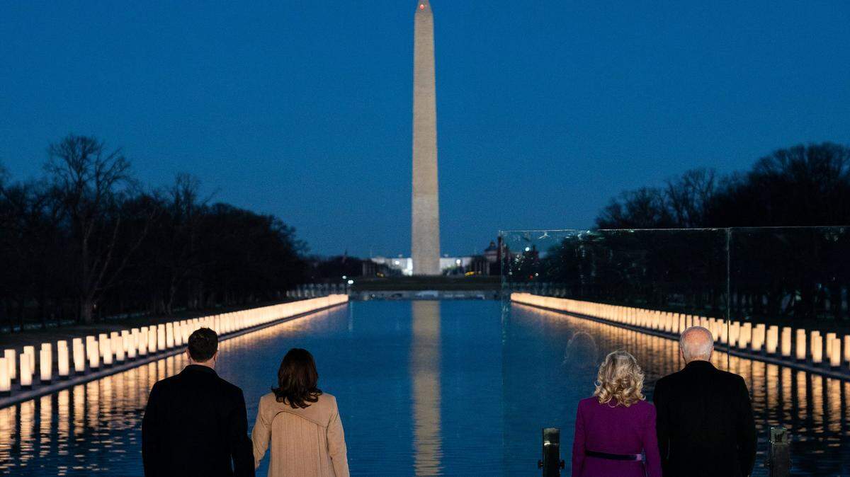 President-elect Joe Biden and his wife Jill Biden are joined by Vice President-elect Kamala Harris and her husband Doug Emhoff during a COVID-19 memorial event at the Lincoln Memorial Reflecting Pool, Tuesday, Jan. 19, 2021, in Washington.