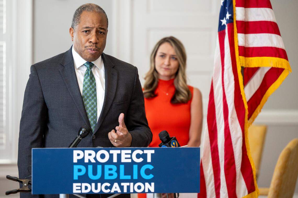Mo Green, the Democratic nominee for state superintendent, speaks during a press conference as North Carolina Democratic Party Chair Anderson Clayton looks on at the state party headquarters in Raleigh on Thursday, March 21, 2024.