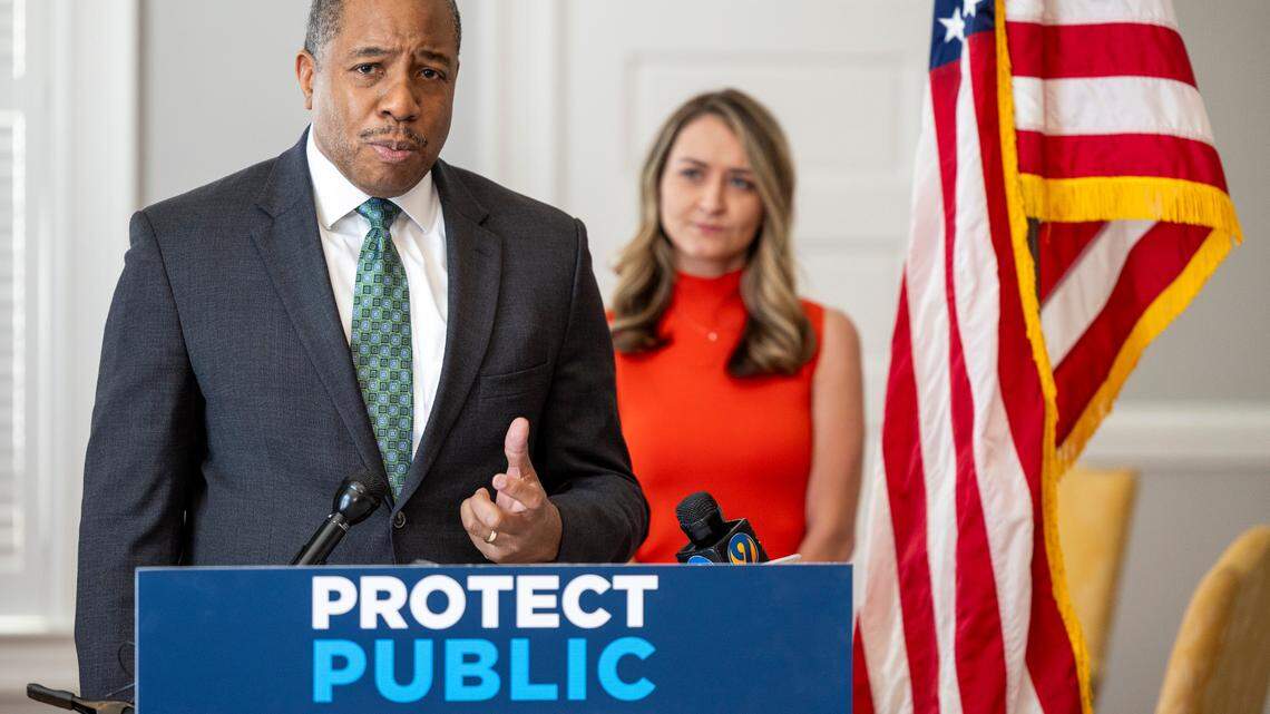 Mo Green, the Democratic nominee for state superintendent, speaks during a press conference as North Carolina Democratic Party Chair Anderson Clayton looks on at the state party headquarters in Raleigh on Thursday, March 21, 2024.