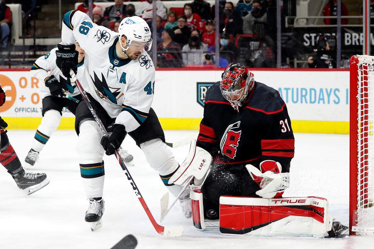 Carolina Hurricanes goaltender Frederik Andersen (31) blocks the shot of San Jose Sharks’ Tomas Hertl (48) during the third period of an NHL hockey game in Raleigh, N.C., Sunday, Jan. 30, 2022. (AP Photo/Karl B DeBlaker)