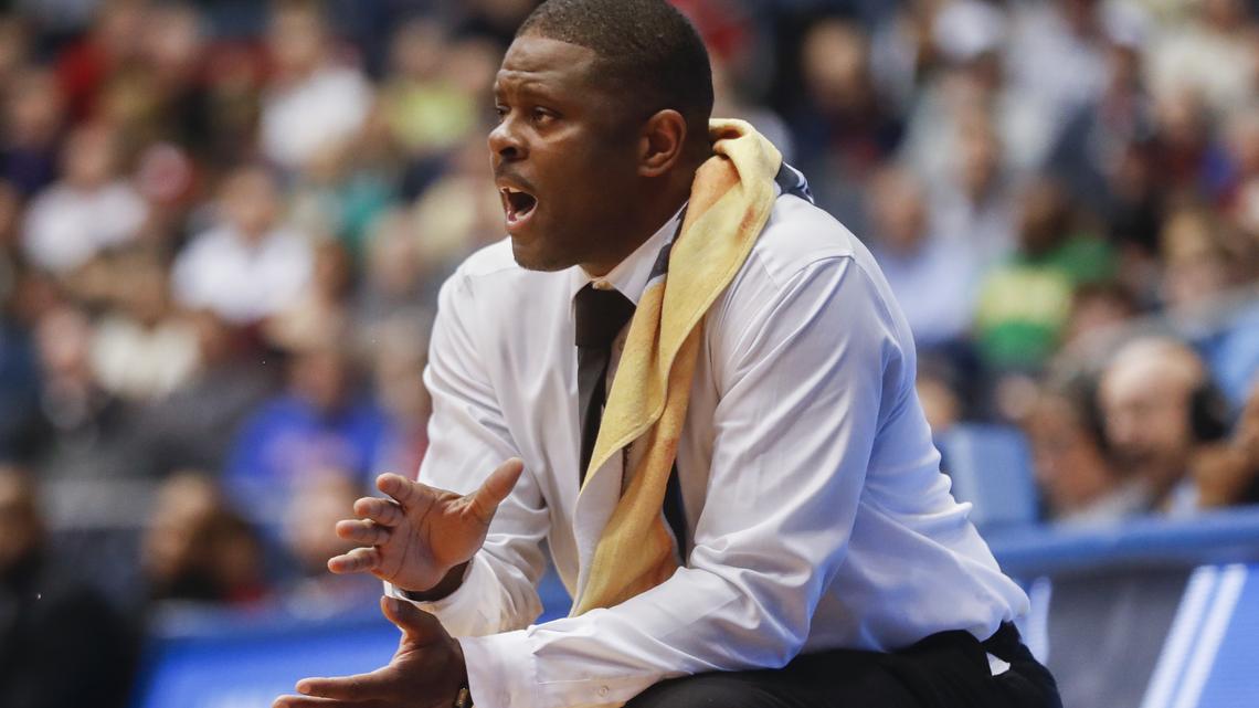 N.C. Central coach LeVelle Moton encourages his team during First Four basketball game against Texas Southern. The Eagles men's basketball program has been affected by the NCAA Committee on Infractions' ruling.
