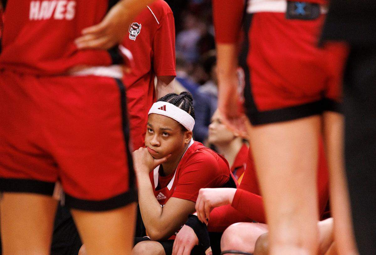 N.C. State’s Zoe Brooks listens in the huddle during a timeout in the second half of the Wolfpack’s 78-59 Final Four loss to South Carolina at Rocket Mortgage FieldHouse on Friday, April 5, 2024, in Cleveland, Ohio.