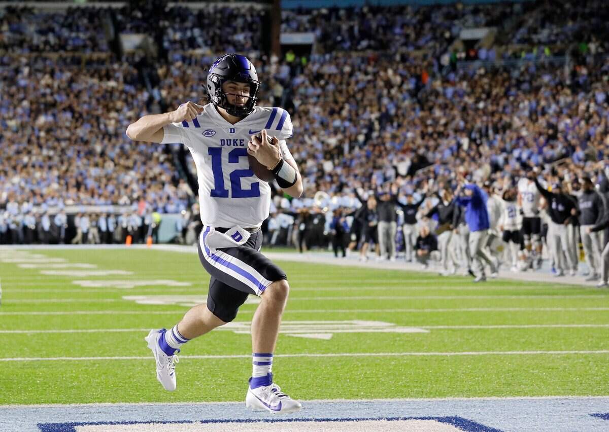 Duke’s Grayson Loftis pumps his fist as he runs the ball into the end zone for a touchdown during the first half of the Blue Devils’ game against North Carolina on Saturday, Nov. 11, 2023, at Kenan Stadium in Chapel Hill, N.C.