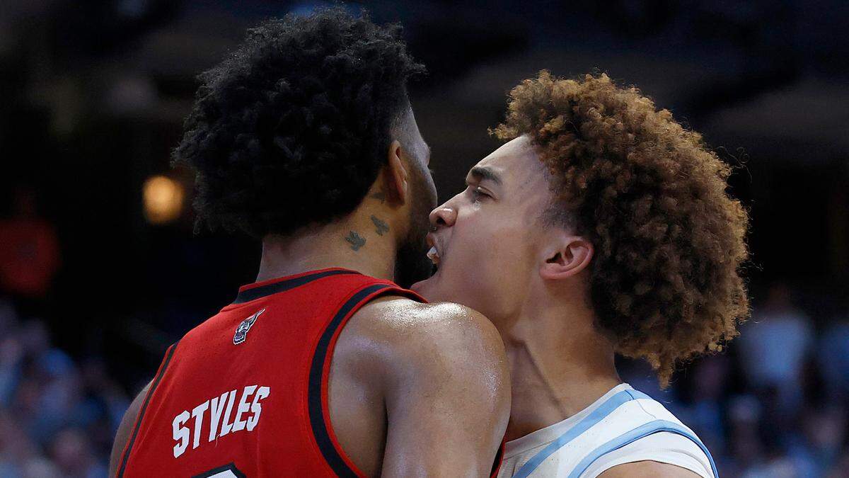 North Carolina’s Seth Trimble reacts after driving to the basket against N.C. State’s Dontrez Styles during the first half of the Tar Heels’ game on Wednesday, Feb. 19, 2025, at the Smith Center in Chapel Hill, N.C. 