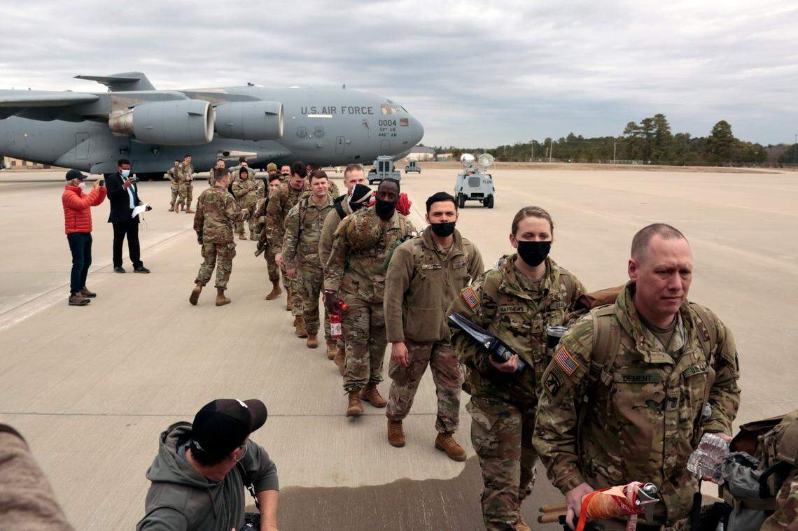 U.S. Army soldiers from the 18th Airborne Division board a C-17 aircraft as they deploy to Europe, Thursday, Feb. 3, 2022 from Fort Bragg, N.C. President Joe Biden is ordering 2,000 U.S. troops to Poland and Germany amid the stalled talks with Russia over the Kremlin’s military buildup on Ukraine’s borders.