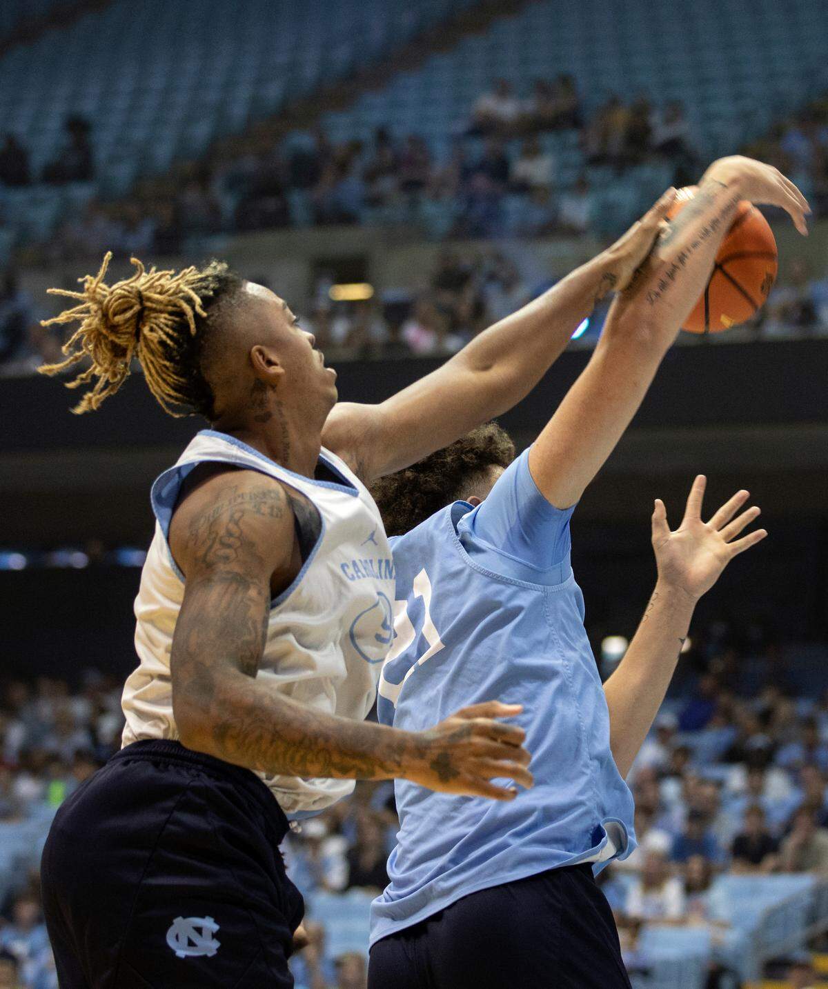 Armando Bacot and Will Shaver battle for a rebound during a scrimmage at “Live Action with Carolina Basketball” at the Dean E. Smith Center on Friday, Oct. 7, 2022, in Chapel Hill, N.C.