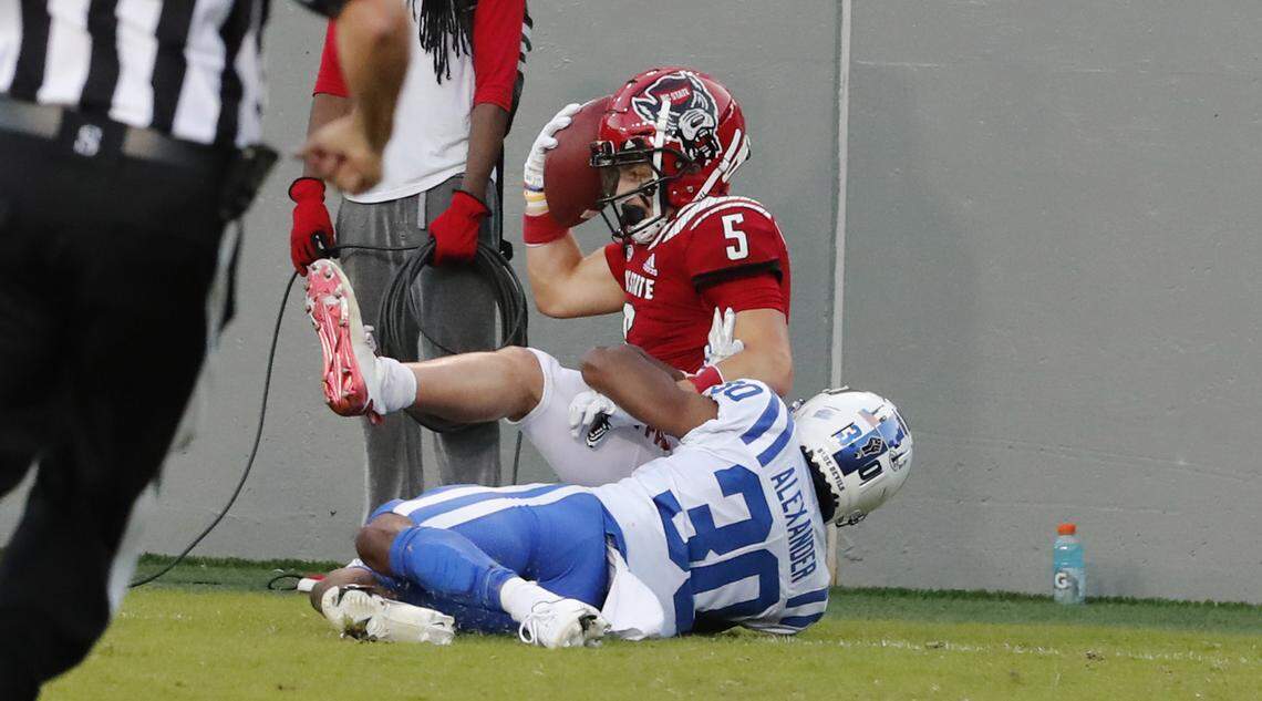 N.C. State wide receiver Thayer Thomas (5) makes a touchdown reception while defended by Duke safety Jalen Alexander (30) defends during the second half of N.C. State’s 31-20 victory over Duke at Carter-Finley Stadium in Raleigh, N.C., Saturday, Oct. 17, 2020.