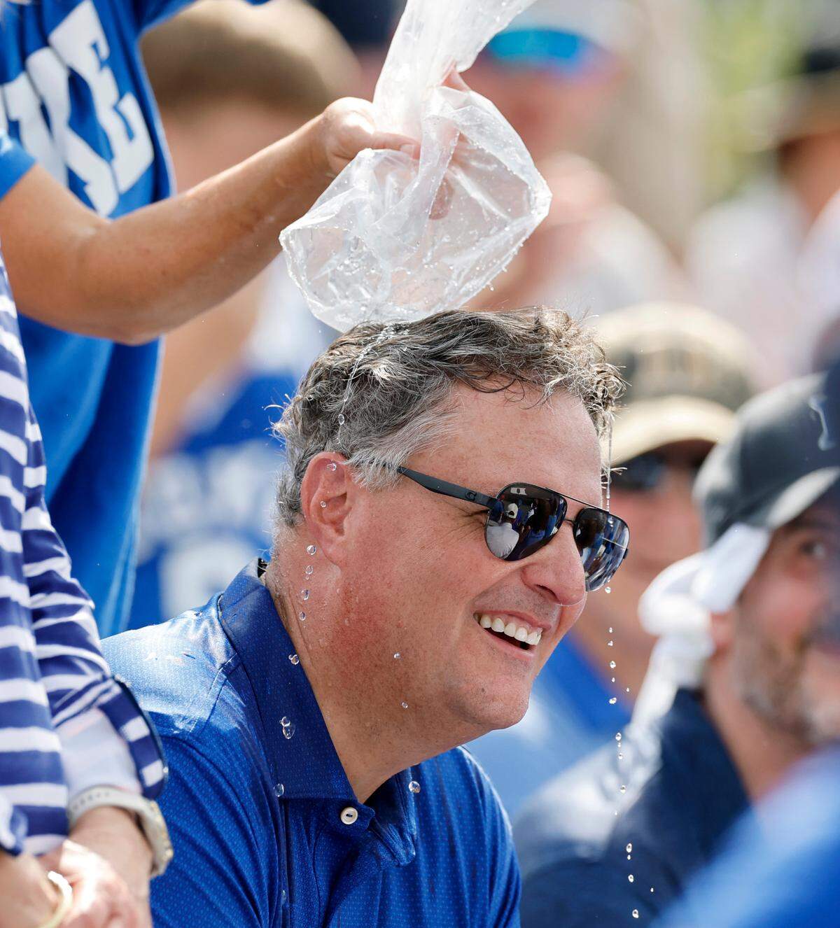Duke alum Mark McLaughlin gets ice water dumped on his head to cool him down during Duke’s 7-4 victory over Murray St. in the first game of Durham Super Regional at Jack Coombs Field in Durham, N.C., Sat. June 7, 2025.