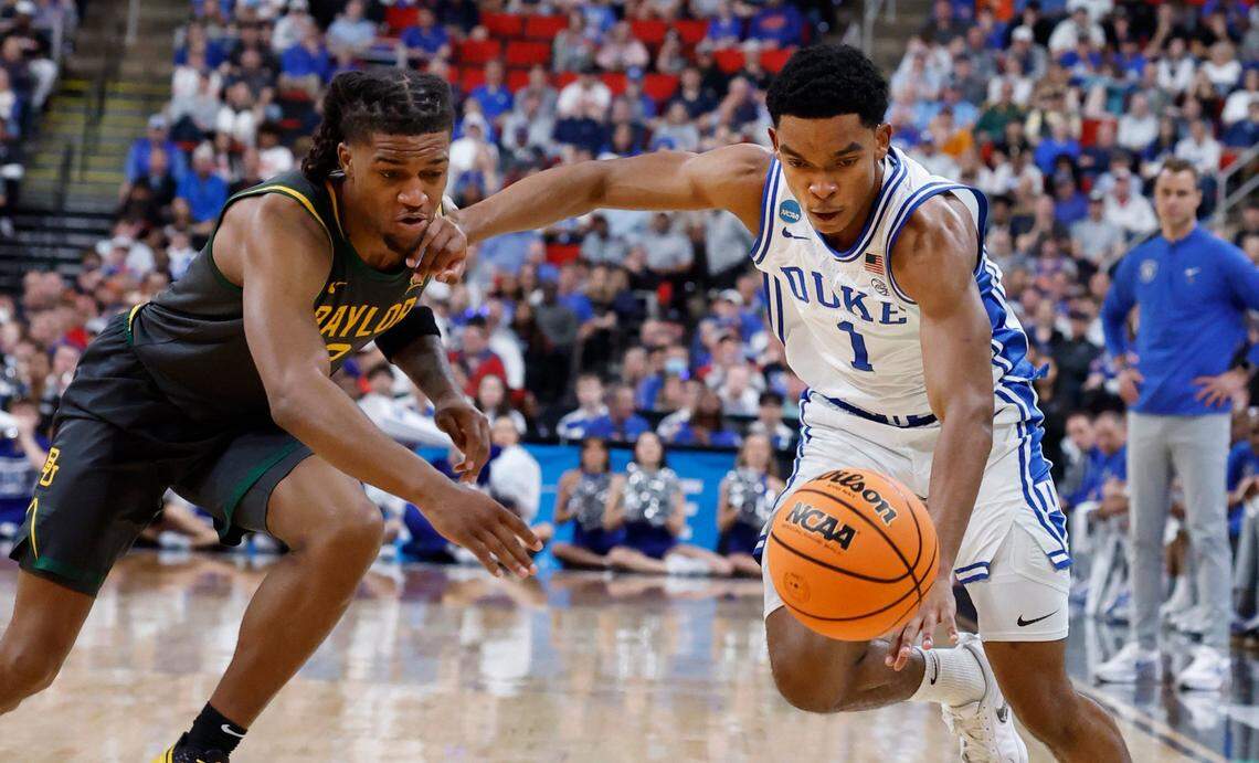 Duke’s Caleb Foster (1) and Baylor’s Jayden Nunn (2) go after the ball during the first half of Duke’s game against Baylor in the second round of the 2025 NCAA men’s basketball championship at the Lenovo Center in Raleigh, N.C., Sunday, March 23, 2025.