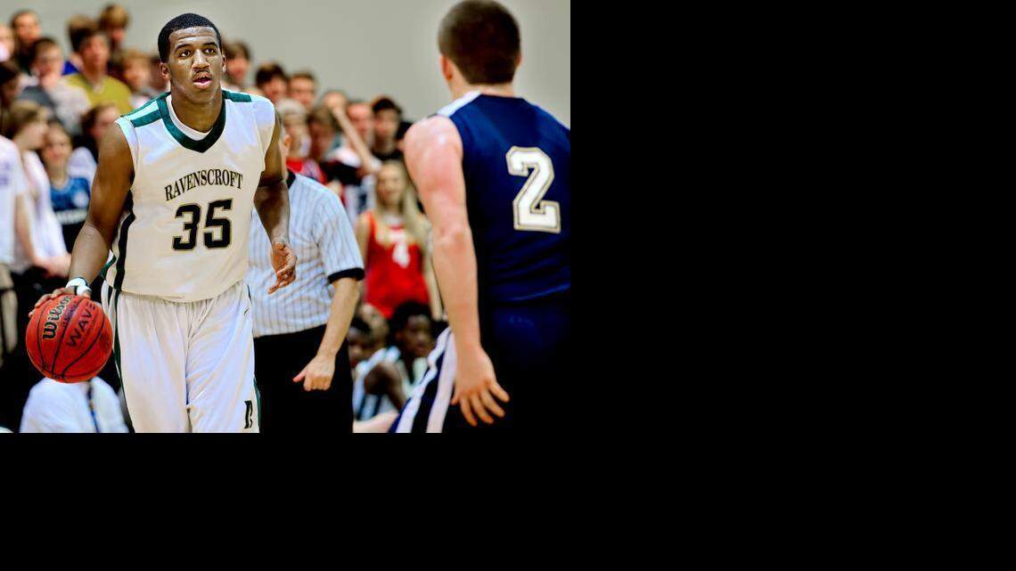 Ravenscroft sophomore Ian DuBose (35) moves the ball up court as St. David’s senior Reef Ivey (2) defends on November 25 in Raleigh. Ravenscroft won the game, 76-42.
