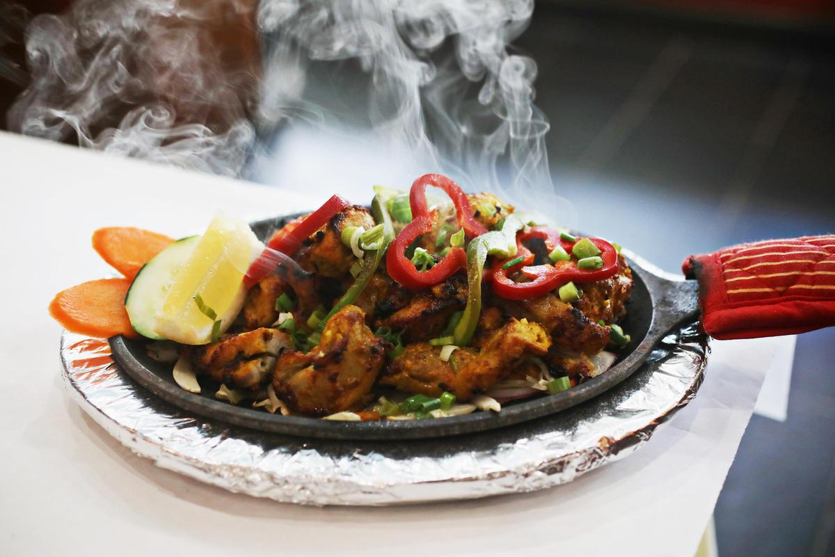 Himalayan Grill & Bar’s chicken sekuwa is marinated and tandoori-grilled boneless chicken served on a cast iron sizzle platter.
