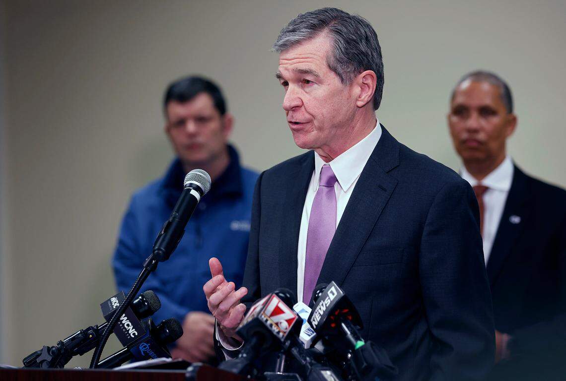 North Carolina Gov. Roy Cooper speaks during a press conference about the power outage in Moore County on Monday, Dec. 5, 2022, in Carthage, N.C.