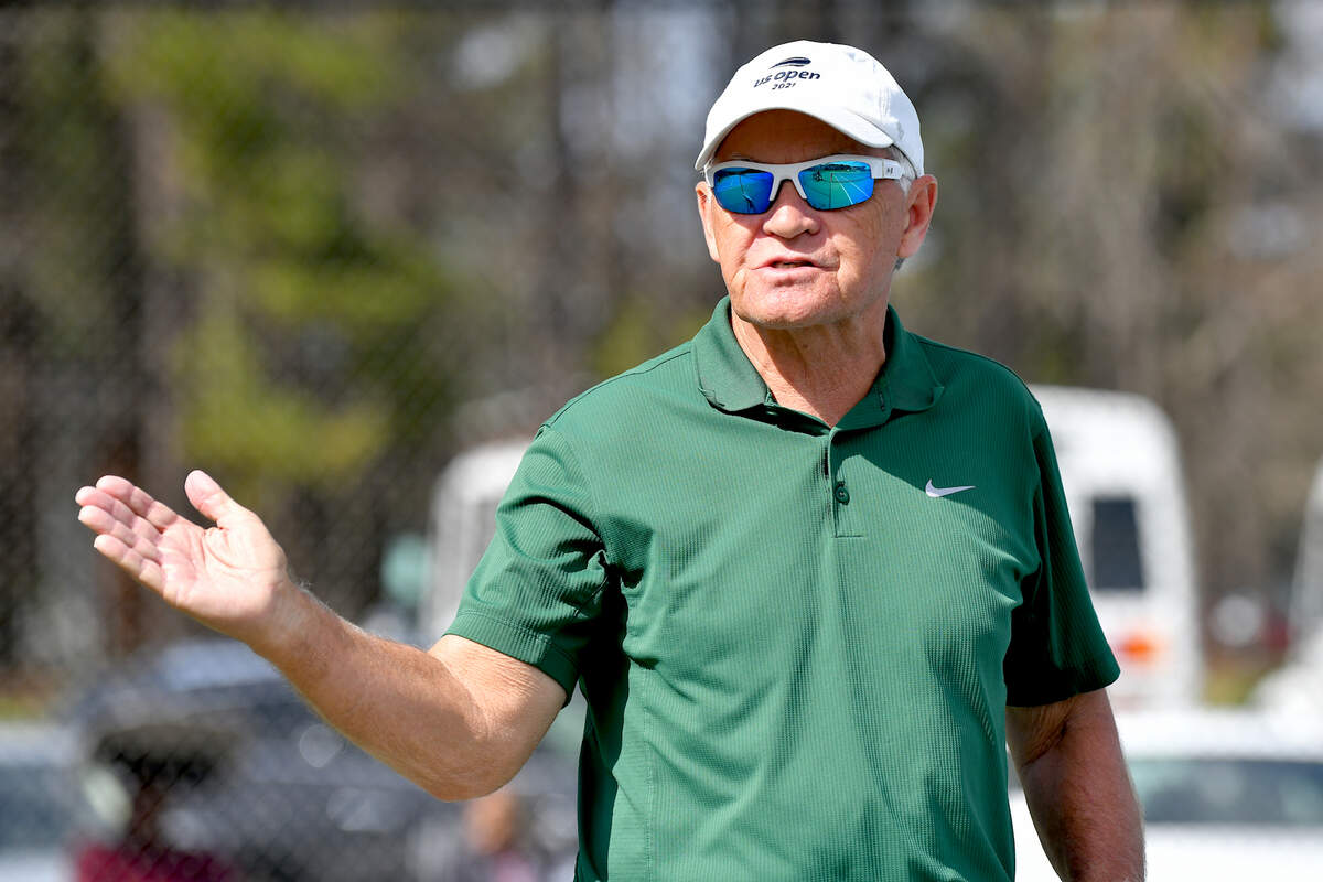 Enloe head coach Steve Spivey gives direction to his team before their match with Athens Drive. Enloe tennis head Coach Steven Spivey gets his 1100th career victory with a win over Athens Drive High in Raleigh, N.C. on March 25, 2022.