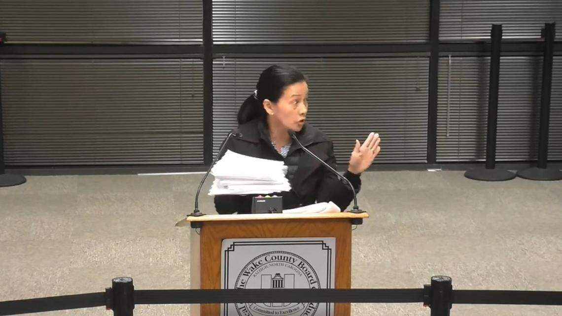 Katie Long speaks at the Wake County school board meeting on Jan. 18, 2022 in Cary, N.C., where she served papers on board members saying she’d file a bond insurance claim against them if they don’t drop the face mask mandate.