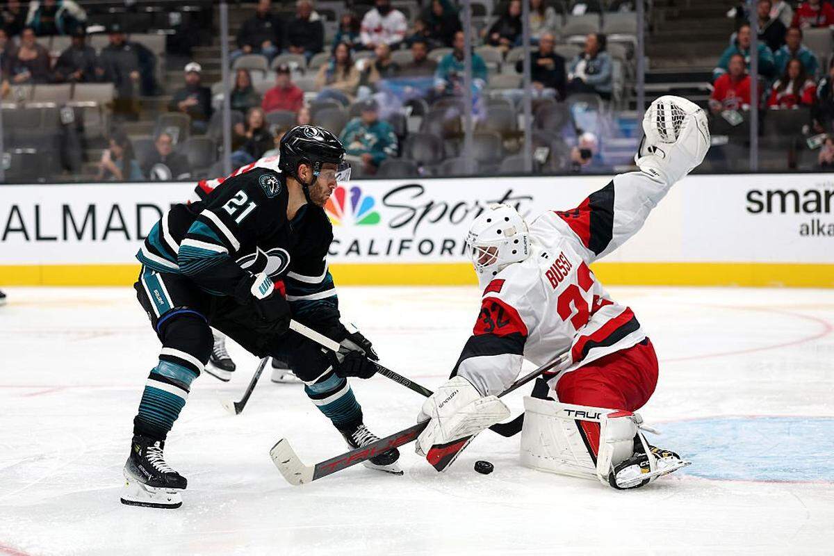 Brandon Bussi of the Carolina Hurricanes makes a save on a shot by Alexander Wennberg of the San Jose Sharks during the second period at SAP Center on Oct. 14, 2025 in San Jose, California.