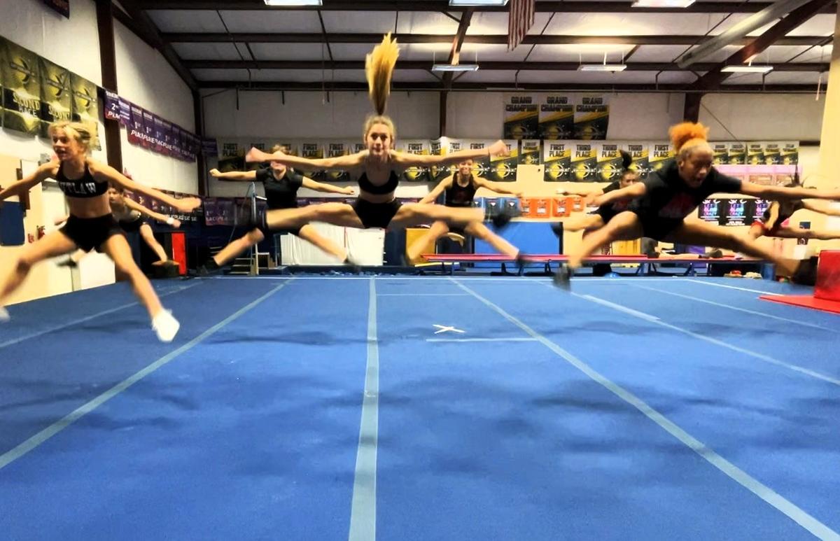 The Outlaw cheerleaders from Hillsborough Cheer Dance and Gymnastics show off their powerful jumps during a practice run on Wednesday, Nov. 13, 2024, in Orange County, NC. Four members will perform in the Macy’s Thanksgiving Day Parade.