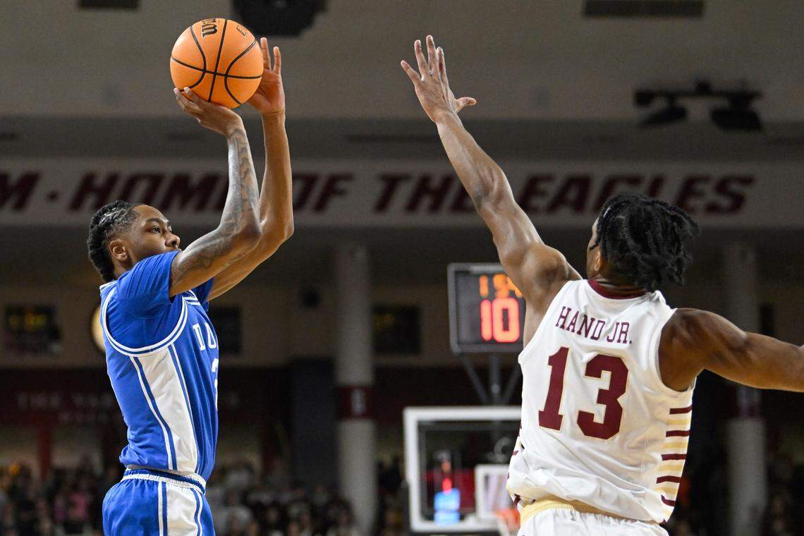 Duke Blue Devils guard Isaiah Evans (3) shoots over Boston College Eagles guard Donald Hand Jr. (13) during the first half at Conte Forum Sat. Jan. 18, 2025.