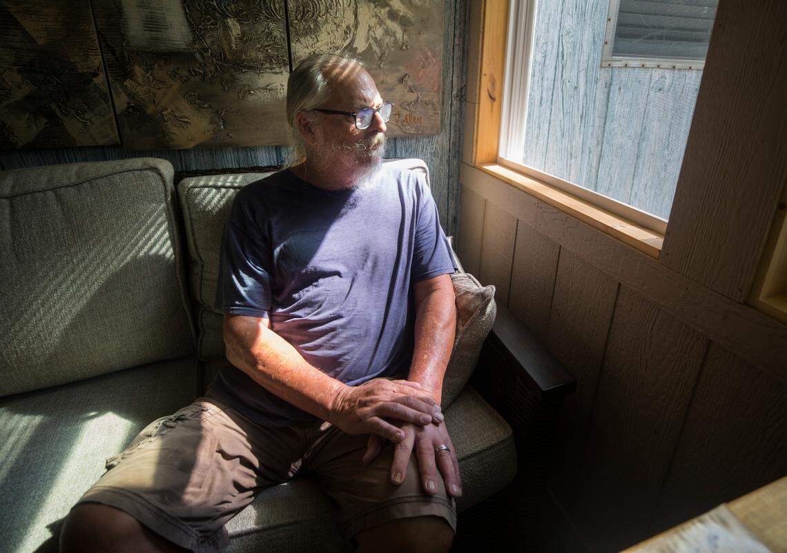 Bill Moran, a resident of Wellington Mobile Home Park in Wake Forest, N.C., poses for a portrait at his home on Friday, July 16, 2021. Moran hosts meetings in his yard where neighbors, with the help of local organizations, are planning cooperative strategies to protect their community from displacement as a result of development.