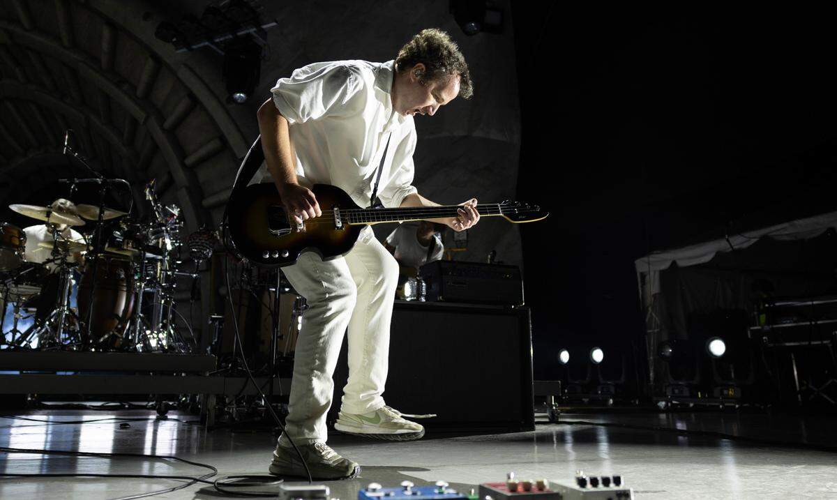 Vampire Weekend bassist Chris Baio in concert at Raleigh, N.C.’s Red Hat Amphitheater, Wednesday night, Oct. 9, 2024.