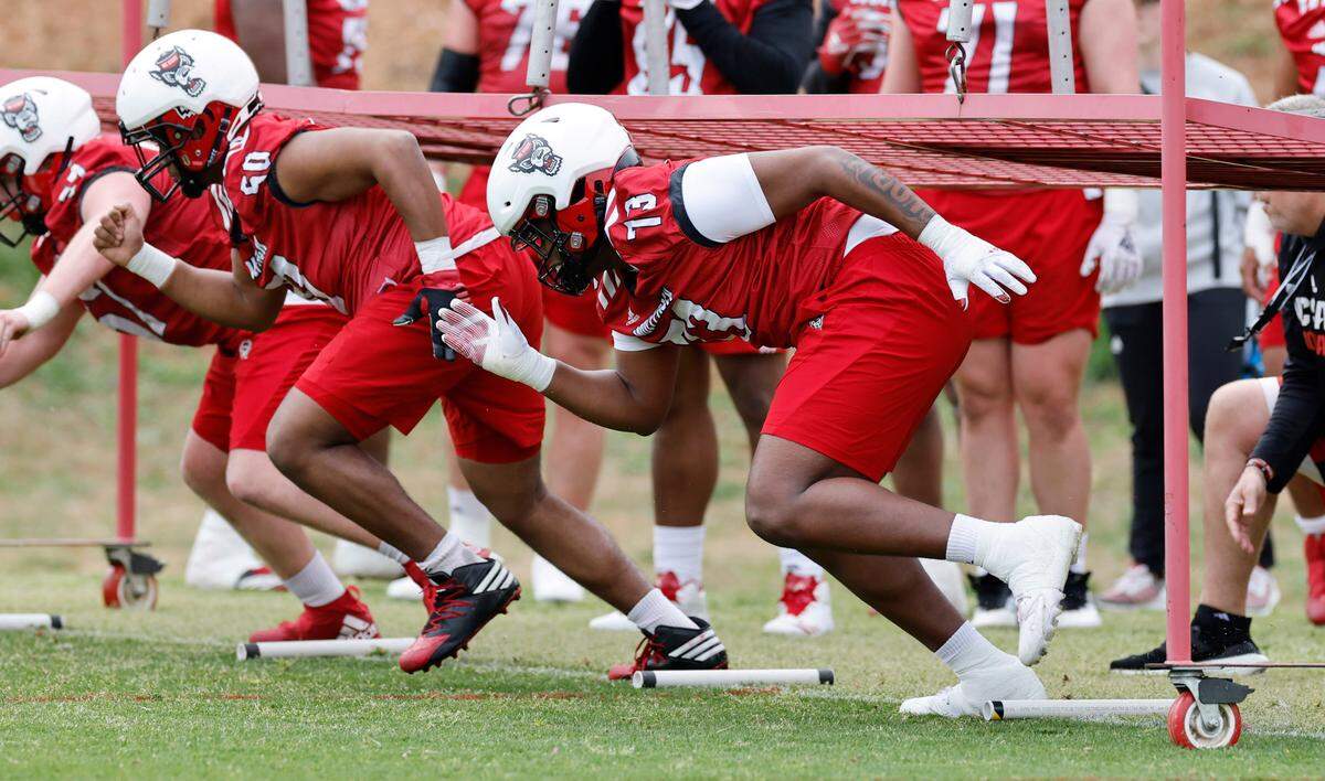 N.C. State offensive lineman Darion Rivers (73) runs drills during the Wolfpack’s first spring practice in Raleigh, N.C., Wednesday, March 1, 2023.