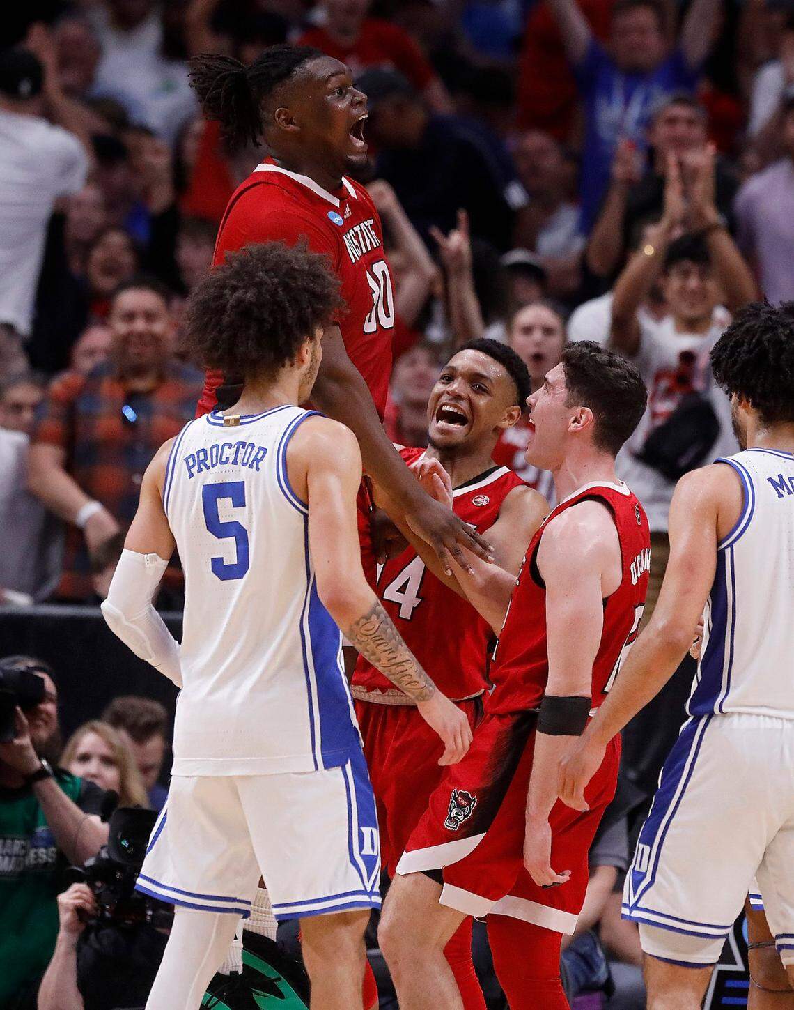 N.C. State’s DJ Burns Jr. reacts following an and-one in the second half of the Wolfpack’s 76-64 win over Duke in the NCAA Tournament Elite Eight on Sunday, March 31, 2024, at American Airlines Center in Dallas, Texas.