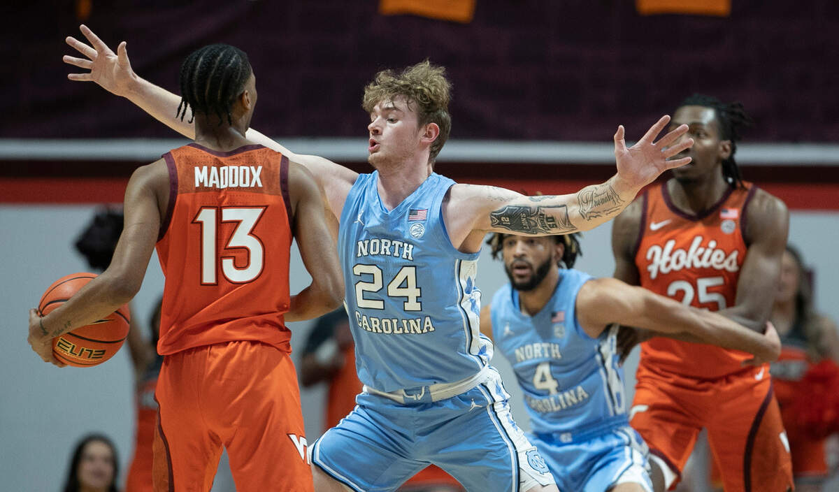 North Carolina’s Tyler Nickel (24) defends Virginia Tech’s Darius Maddox (13) during the first half on Sunday, December 4, 2022 at Cassell Coliseum in Blacksburg, Va.