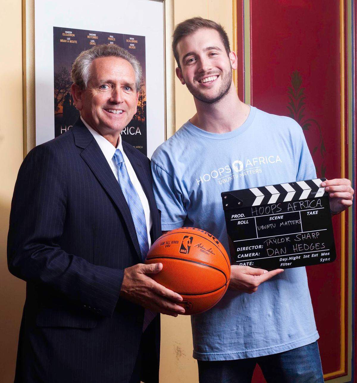 UNC Athletic Director Bubba Cunningham (left) poses with UNC graduate and film director Taylor Sharp.