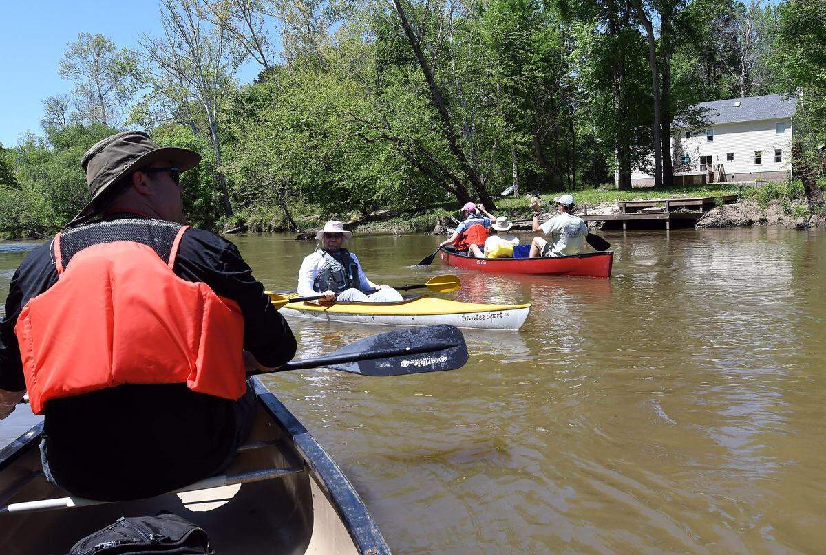 Paddlers take a break on the Neuse River north of where the Milburnie Dam used to be in Wake County in Raleigh,N.C., Tuesday, May 1, 2018.