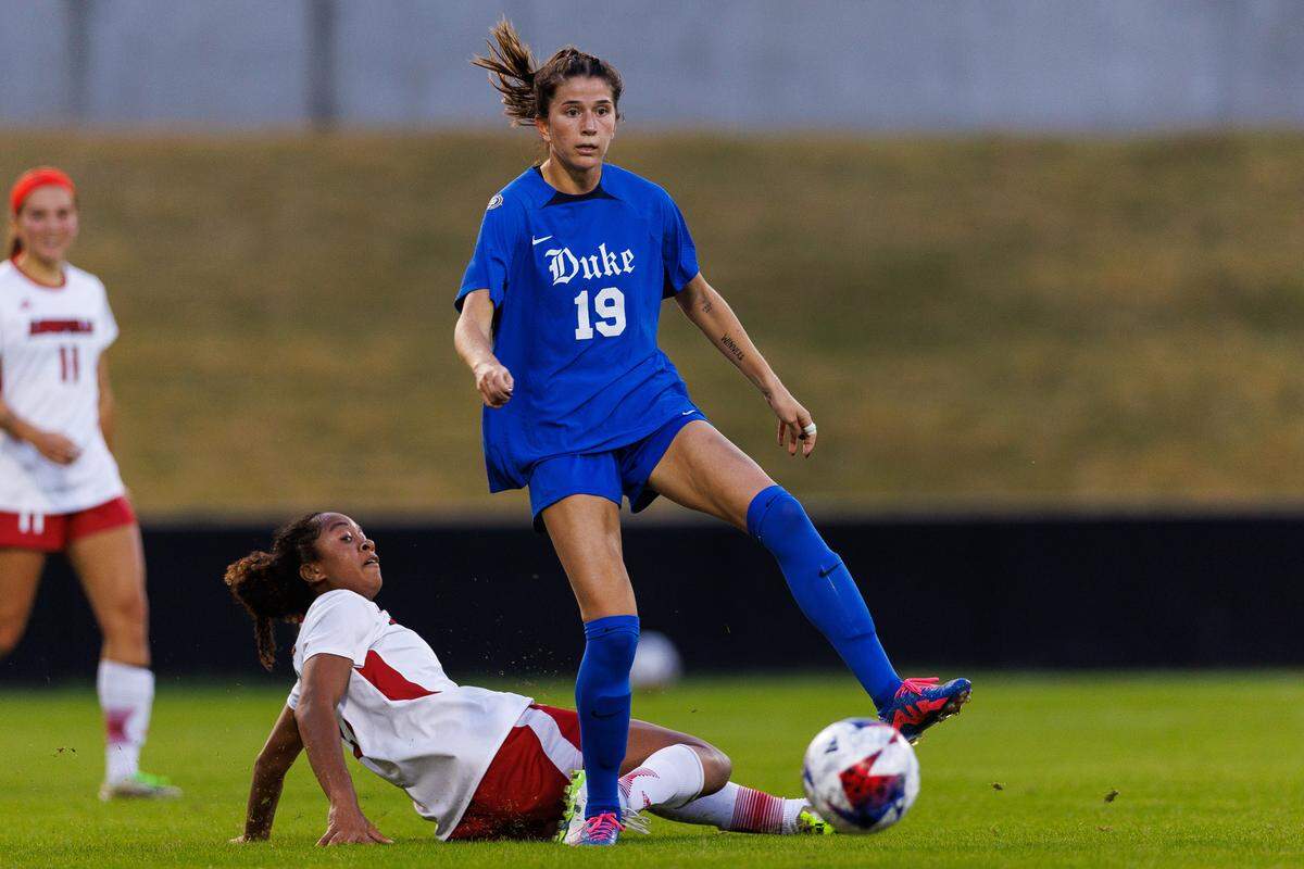 Duke Blue Devils midfielder Maggie Graham (19) kicks the ball during the first half against the Louisville Cardinals at Dr. Mark & Cindy Lynn Stadium on Oct. 26, 2023.