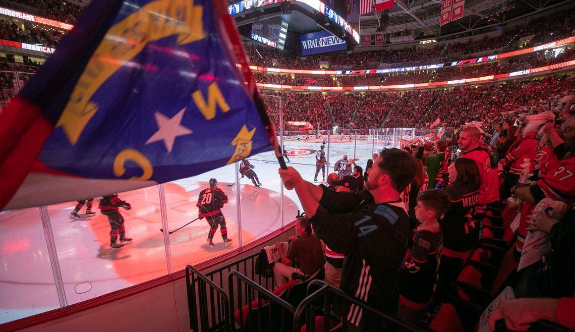 Fans welcome the Carolina Hurricanes to the ice for game two of their second round Stanley Cup series on June 1, 2021 at PNC Arena in Raleigh.