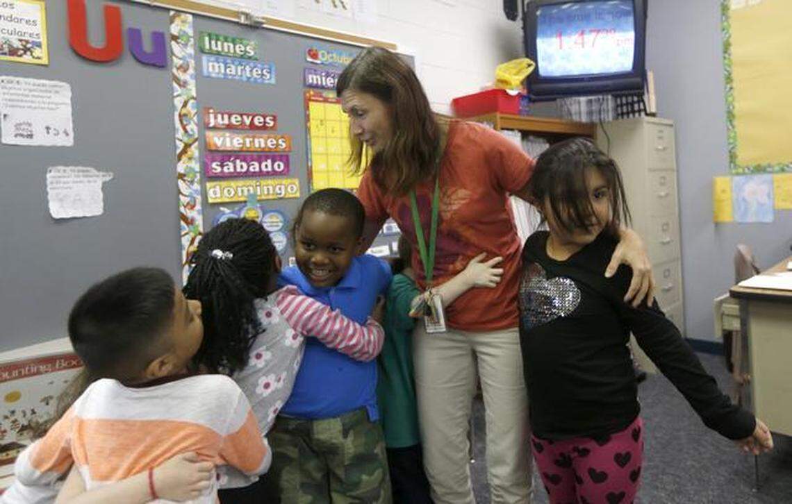 Yahriel Guerrero, Jade Haskins, Mathew Keith and Jaylene Rivera, from left, do a number counting game with Monica Arbeláez in Arbeláez’s kindergarten class at Jeffreys Grove Elementary School in Raleigh on Wednesday. School administrators want Jeffreys Grove and Stough elementary schools in Raleigh and Hodge Road Elementary School in Knightdale to become magnet schools.