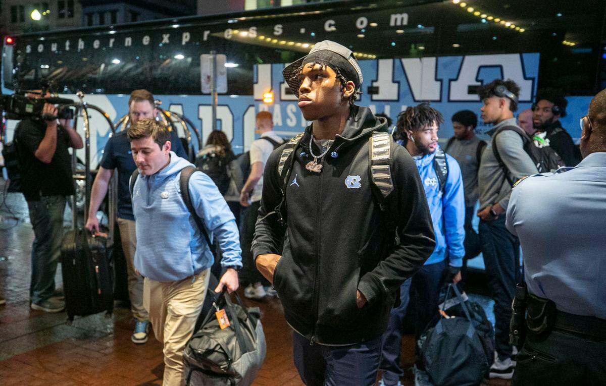 North Carolina’s Caleb Love (2) enters the team hotel, the Sheraton on Canal Street, as the Tar Heels arrive for the NCAA Final Four on Wednesday, March 30, 2022 in New Orleans, La.