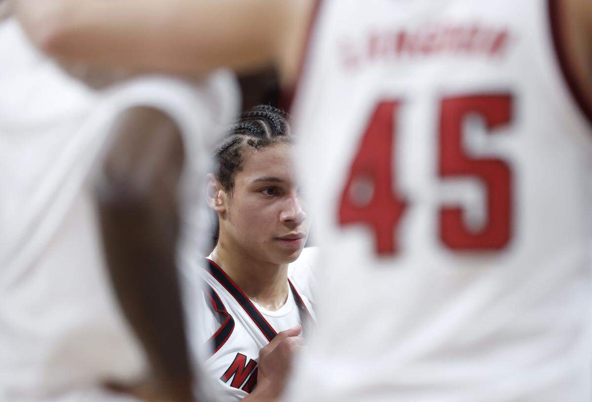 N.C. State’s Matt Able listens in the huddle during a timeout in the second half of the Wolfpack’s 110-64 win over UNC Greensboro on Wednesday, Nov. 12, 2025, at Lenovo Center in Raleigh, N.C.